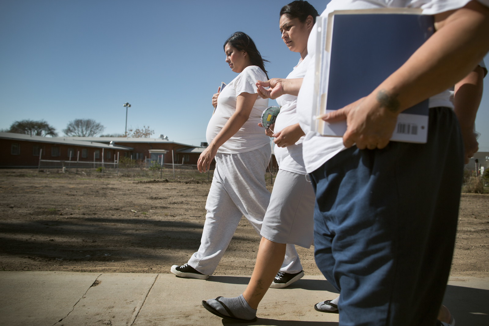 Regina Zodiacal walks with other inmates at the California Institution for Women in Chino, Calif. on March 12th, 2013. Zodiacal, pictured at seven months into her pregnancy, learned she was pregnant when she was awaiting her trial in the Santa Ana county jail. 'It was kind of a shocker to me,' Zodiacal said. 'I used to always think I was never going to be that girl to go to prison and give birth,' she said.